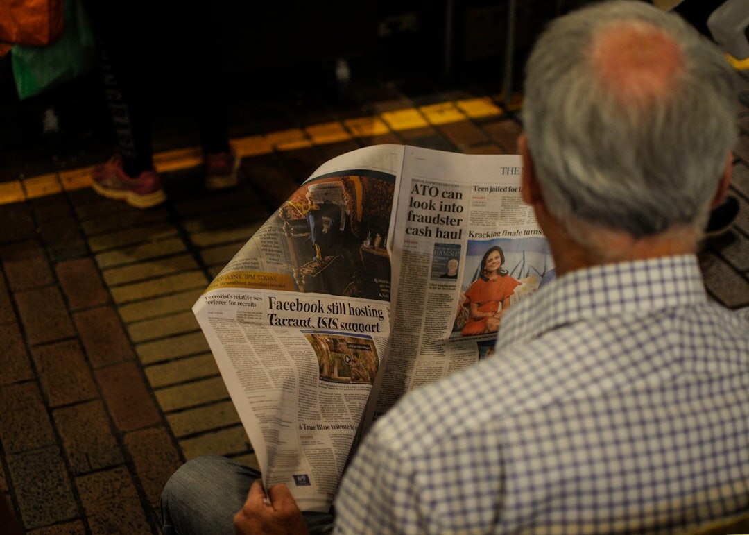 senior reading newspaper