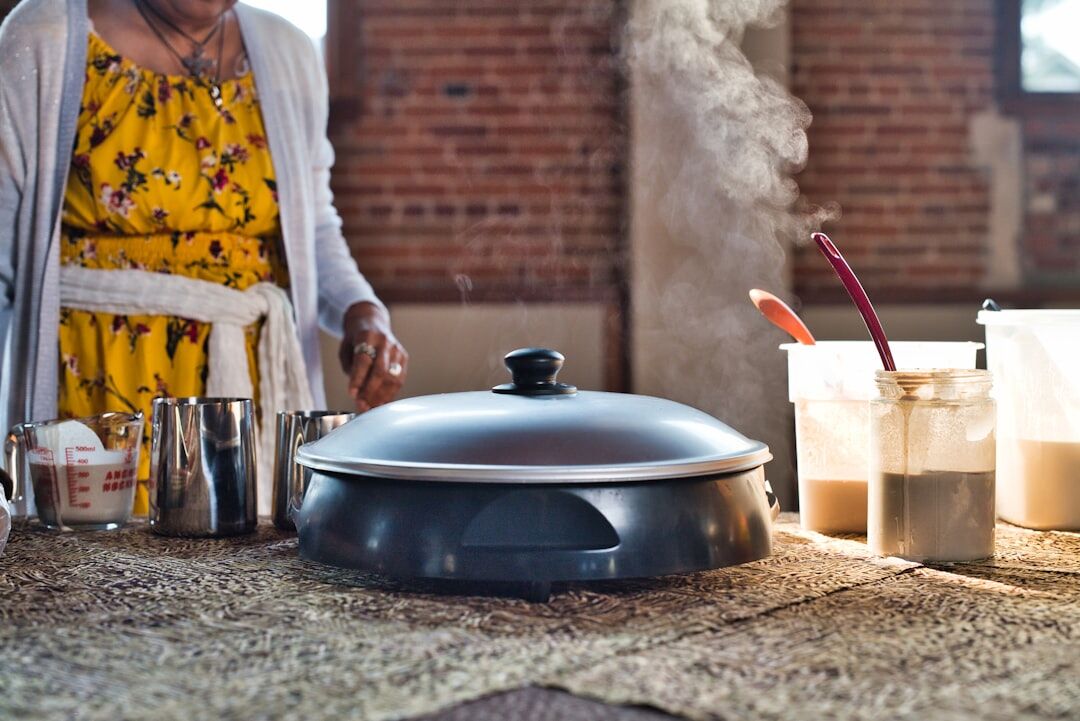 senior cooking with lid on pot