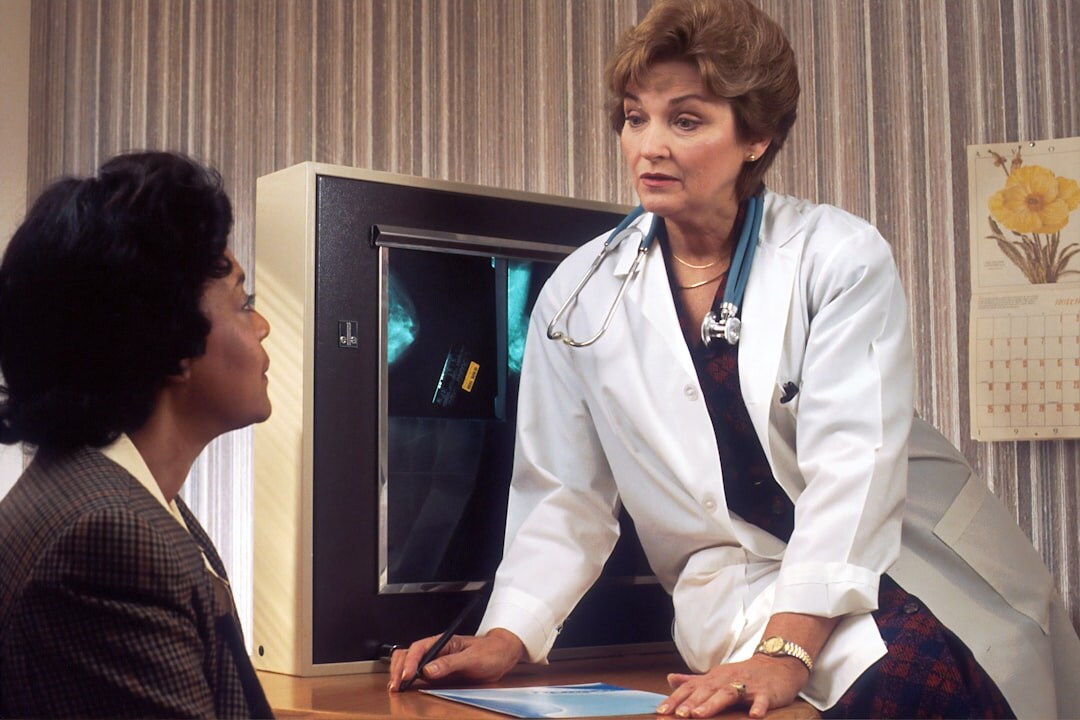 elderly patient talking to doctor