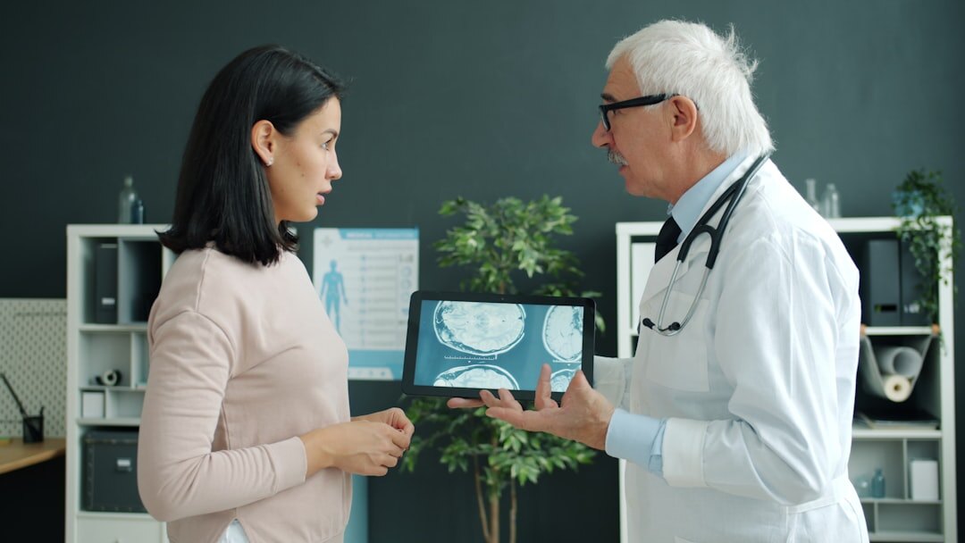 elderly patient talking to doctor