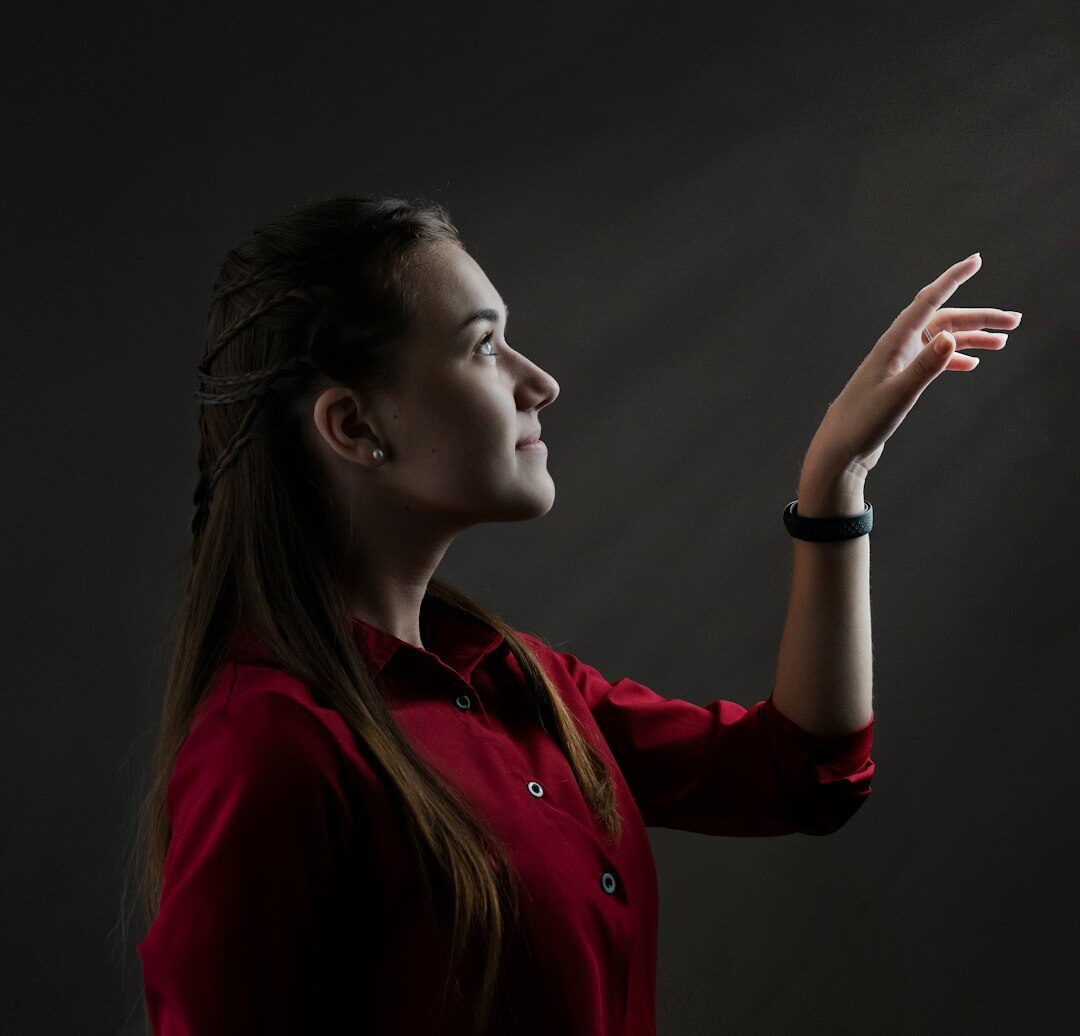 Studio portrait of a cheerful young Slovak woman coordinator